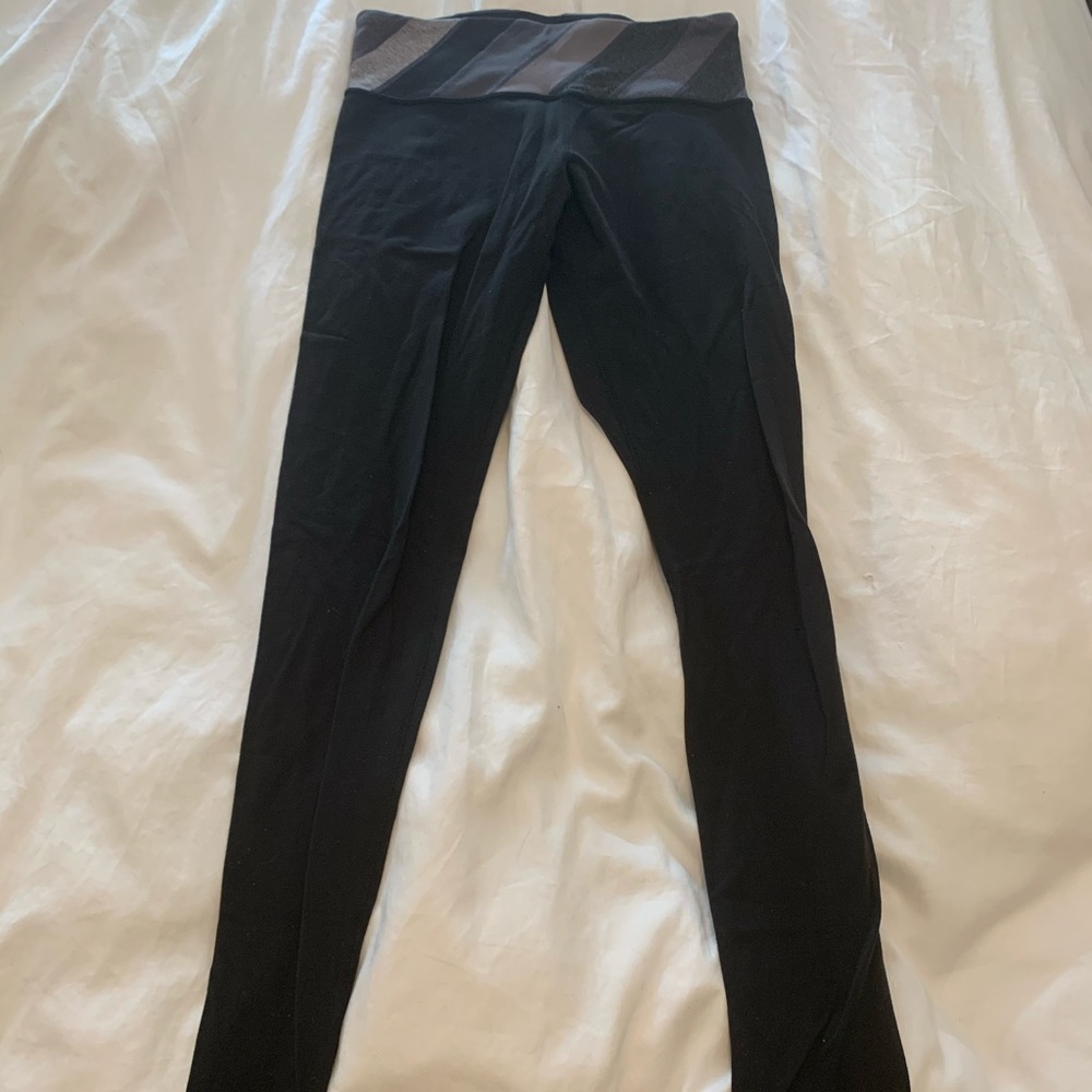 Lululemon black leggings with design at the top!